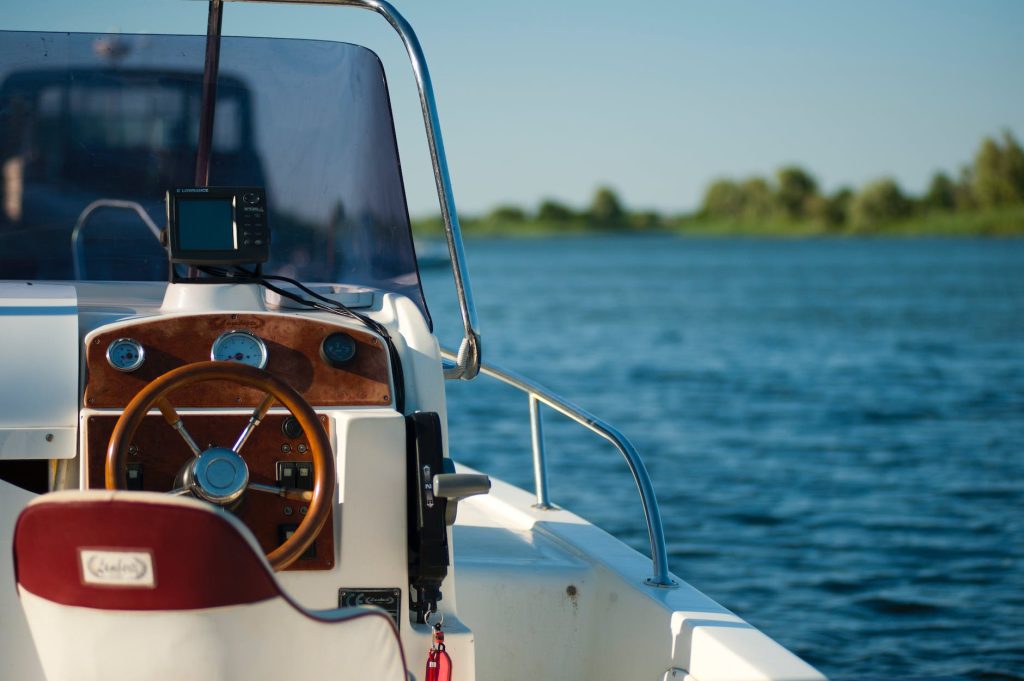 white and brown boat
